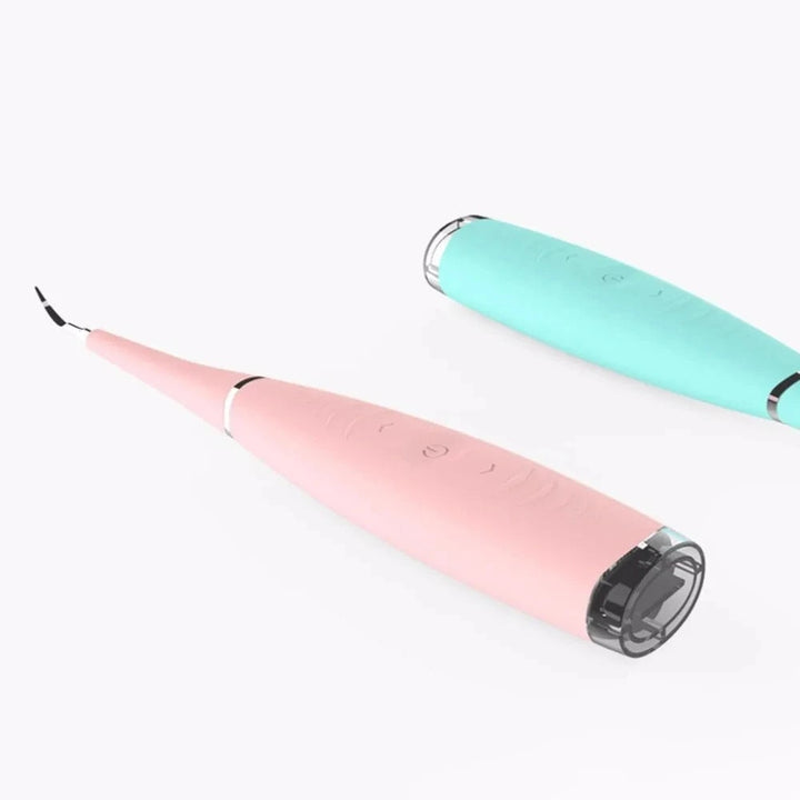 "Pink ultrasonic tooth cleaning wand with adjustable intensity levels, sleek design, portable for effective at-home dental ca