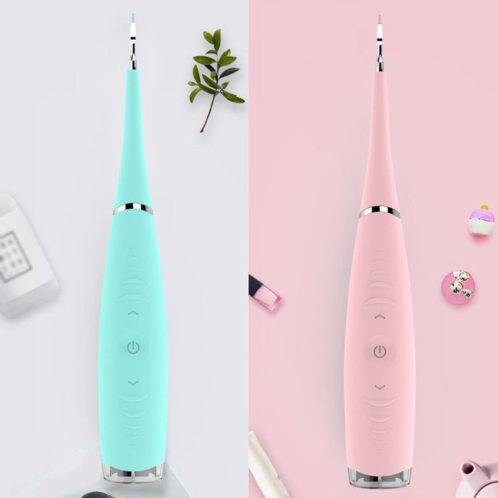 "Pink ultrasonic tooth cleaning wand with adjustable intensity levels, sleek design, portable for effective at-home dental ca