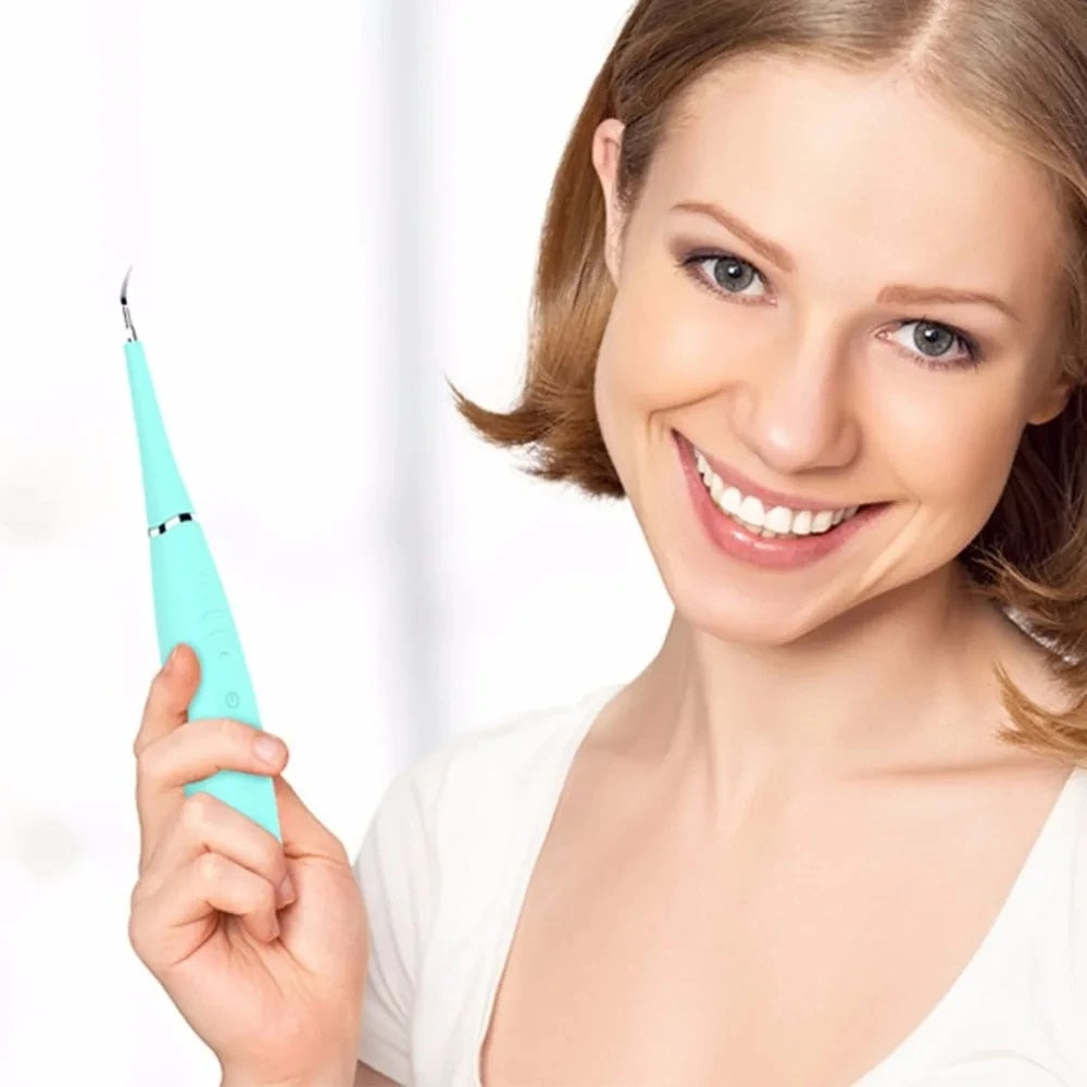 "Pink ultrasonic tooth cleaning wand with adjustable intensity levels, sleek design, portable for effective at-home dental ca