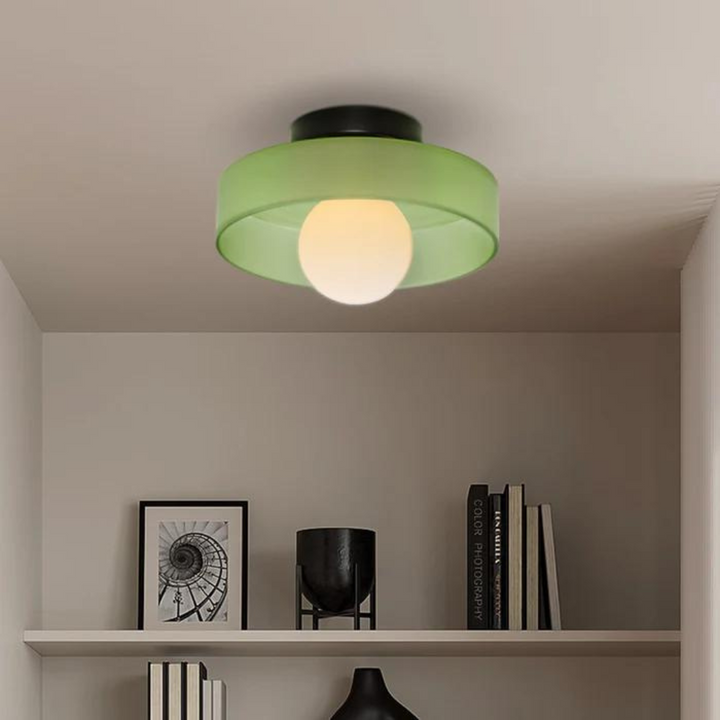 "Round ceiling lamp of high-quality glass in vibrant orange, stylish design, perfect for modern interiors, enhancing any spac