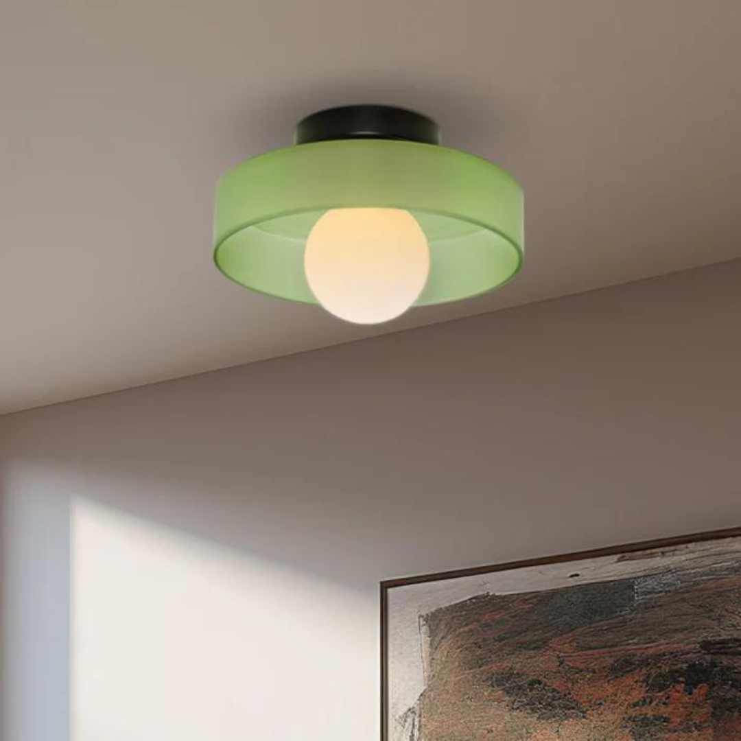 "Round ceiling lamp of high-quality glass in vibrant orange, stylish design, perfect for modern interiors, enhancing any spac