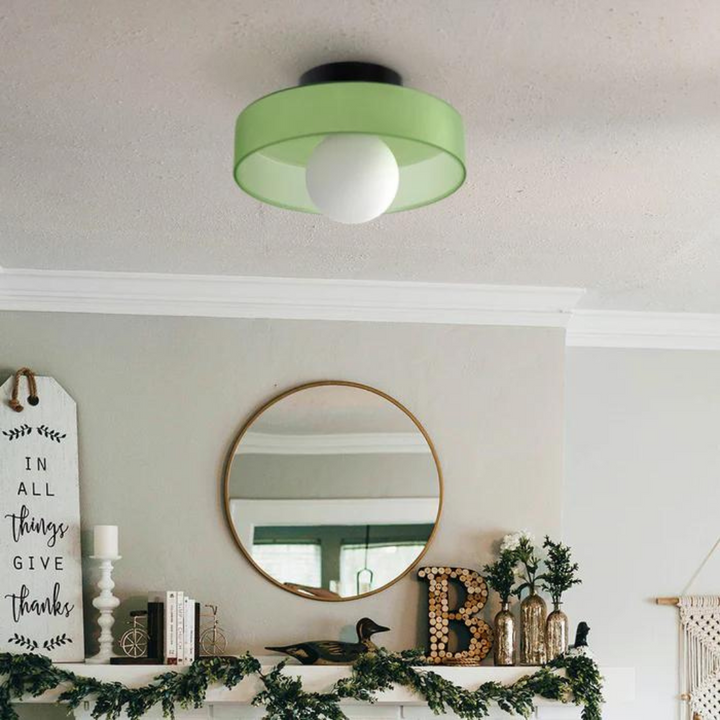 "Round ceiling lamp of high-quality glass in vibrant orange, stylish design, perfect for modern interiors, enhancing any spac
