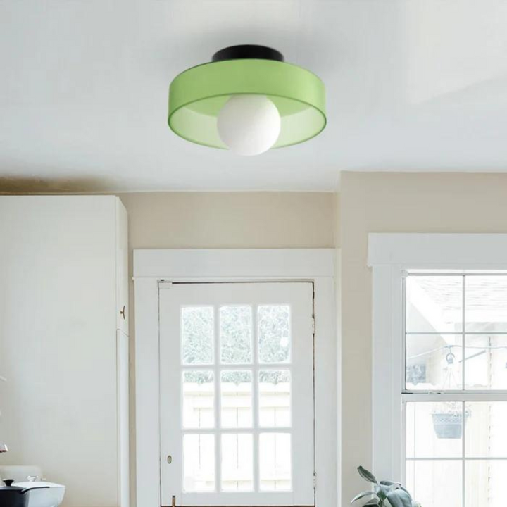 "Round ceiling lamp of high-quality glass in vibrant orange, stylish design, perfect for modern interiors, enhancing any spac