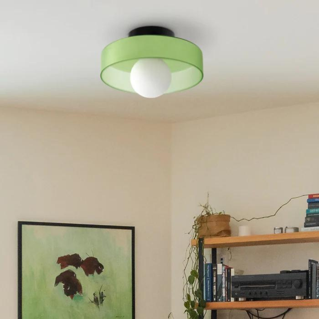 "Round ceiling lamp of high-quality glass in vibrant orange, stylish design, perfect for modern interiors, enhancing any spac