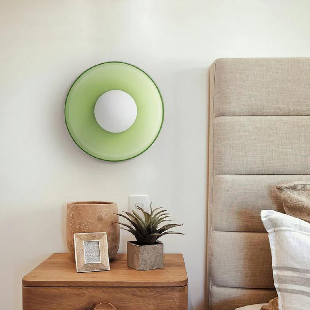 "Round ceiling lamp of high-quality glass in vibrant orange, stylish design, perfect for modern interiors, enhancing any spac