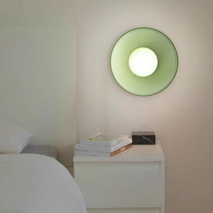 "Round ceiling lamp of high-quality glass in vibrant orange, stylish design, perfect for modern interiors, enhancing any spac