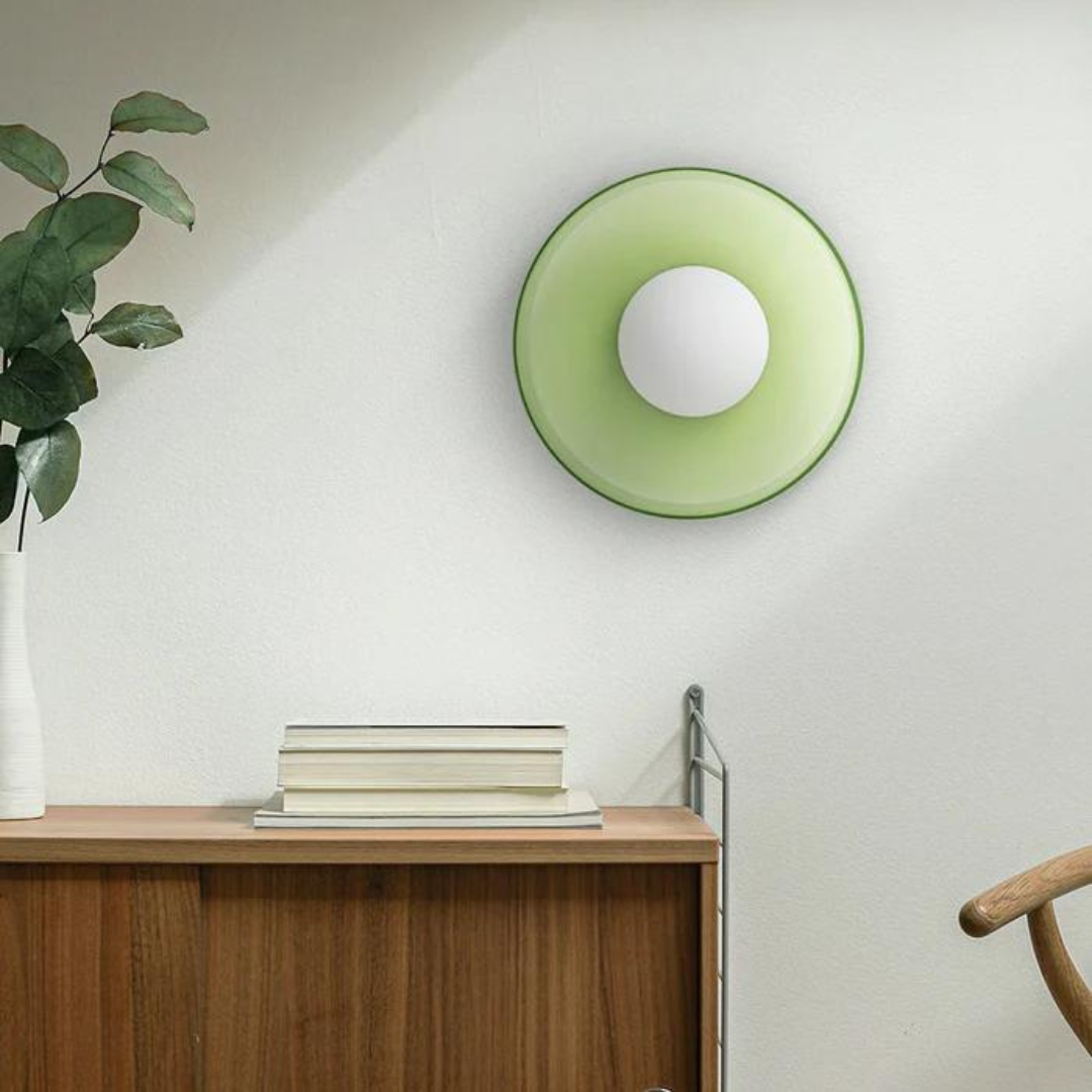 "Round ceiling lamp of high-quality glass in vibrant orange, stylish design, perfect for modern interiors, enhancing any spac