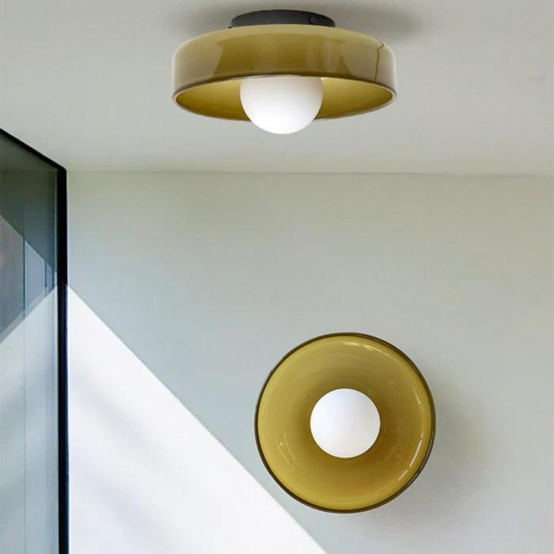"Round ceiling lamp of high-quality glass in vibrant orange, stylish design, perfect for modern interiors, enhancing any spac