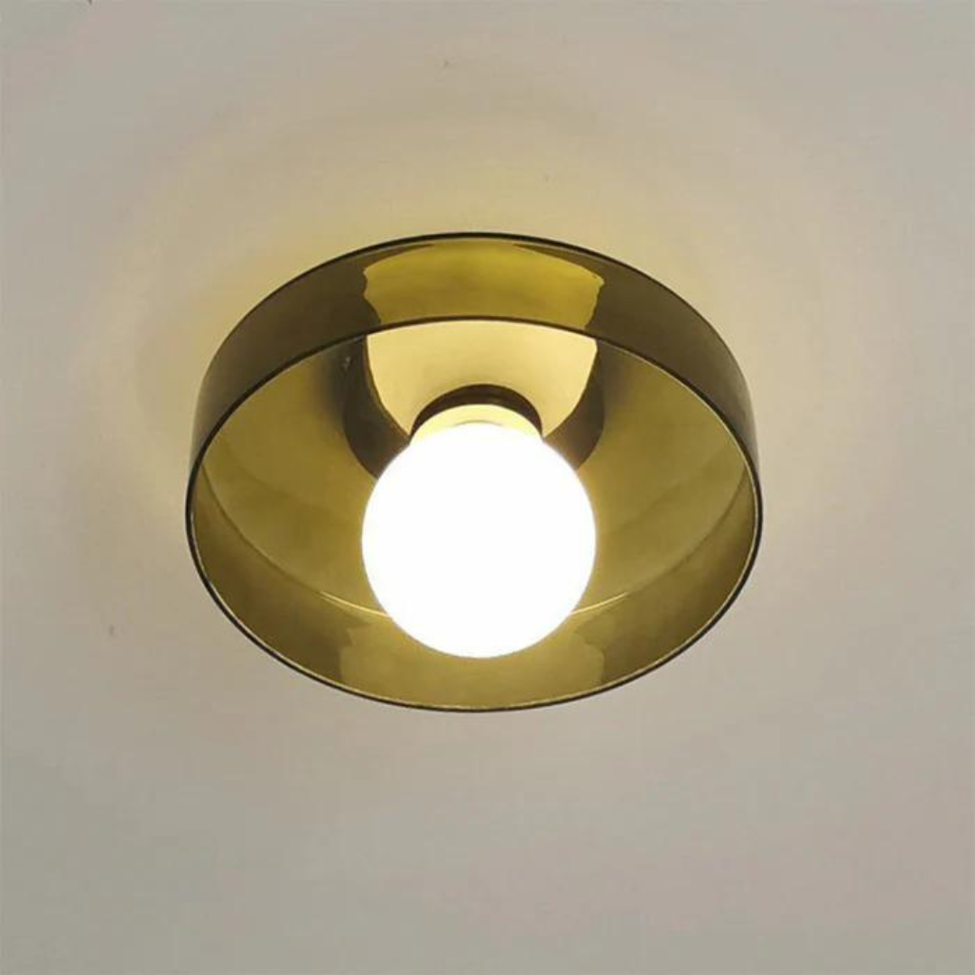 "Round ceiling lamp of high-quality glass in vibrant orange, stylish design, perfect for modern interiors, enhancing any spac