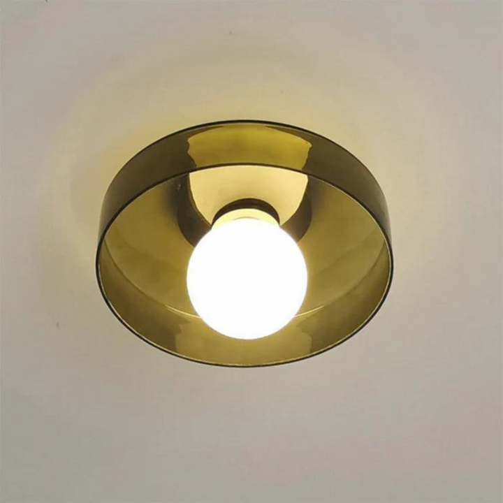 "Round ceiling lamp of high-quality glass in vibrant orange, stylish design, perfect for modern interiors, enhancing any spac