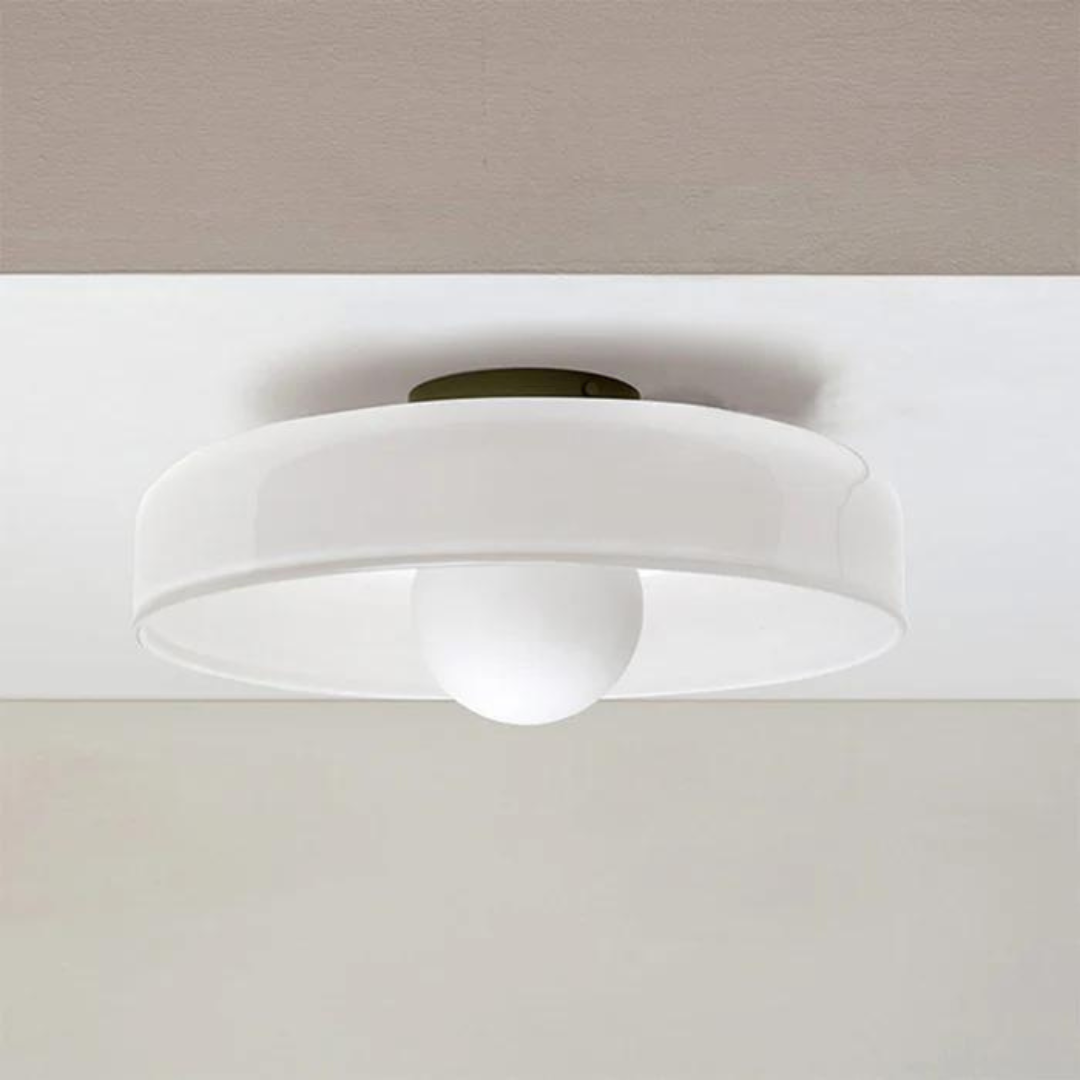 "Round ceiling lamp of high-quality glass in vibrant orange, stylish design, perfect for modern interiors, enhancing any spac