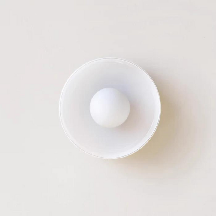 "Round ceiling lamp of high-quality glass in vibrant orange, stylish design, perfect for modern interiors, enhancing any spac