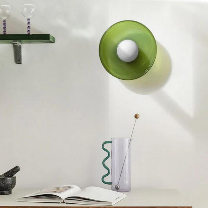 "Round ceiling lamp of high-quality glass in vibrant orange, stylish design, perfect for modern interiors, enhancing any spac