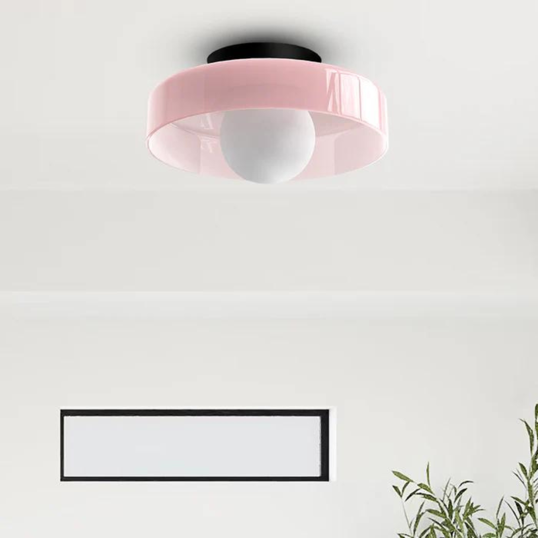 "Round ceiling lamp of high-quality glass in vibrant orange, stylish design, perfect for modern interiors, enhancing any spac