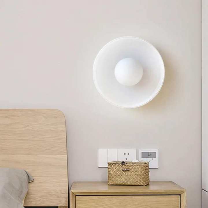 "Round ceiling lamp of high-quality glass in vibrant orange, stylish design, perfect for modern interiors, enhancing any spac