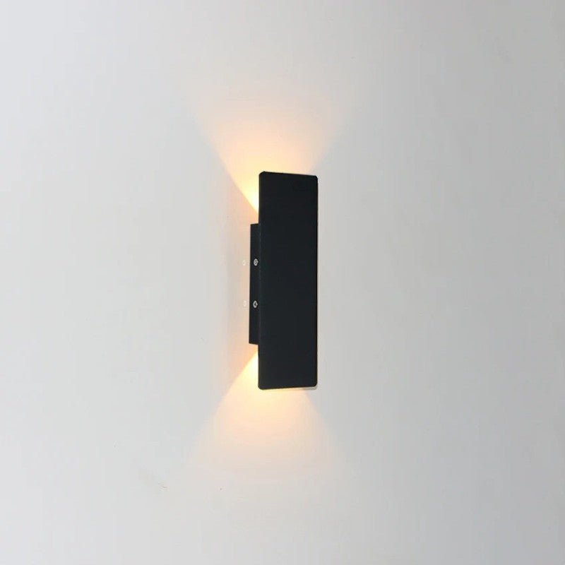 "Sleek black weatherproof LED wall light for outdoor use, featuring modern design and durable aluminum construction."