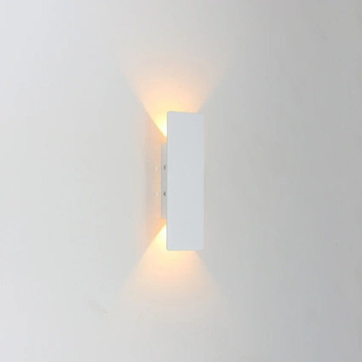 "Sleek black weatherproof LED wall light for outdoor use, featuring modern design and durable aluminum construction."