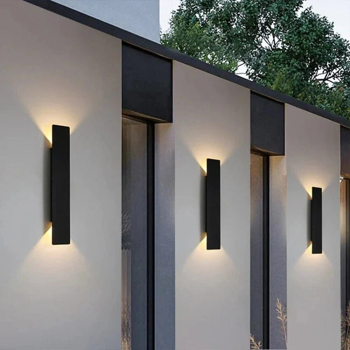 "Sleek black weatherproof LED wall light for outdoor use, featuring modern design and durable aluminum construction."