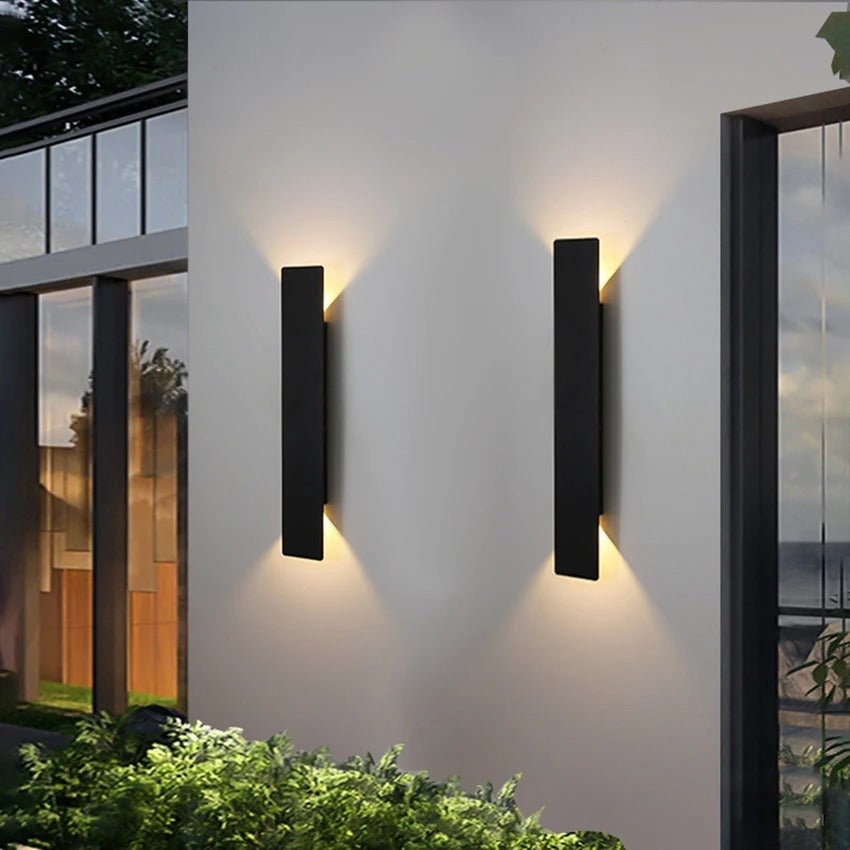 "Sleek black weatherproof LED wall light for outdoor use, featuring modern design and durable aluminum construction."