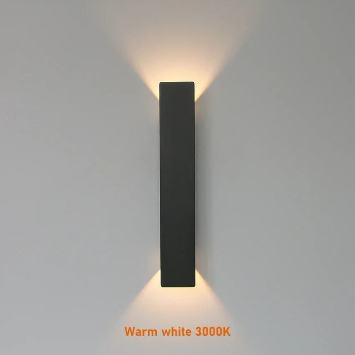 "Sleek black weatherproof LED wall light for outdoor use, featuring modern design and durable aluminum construction."