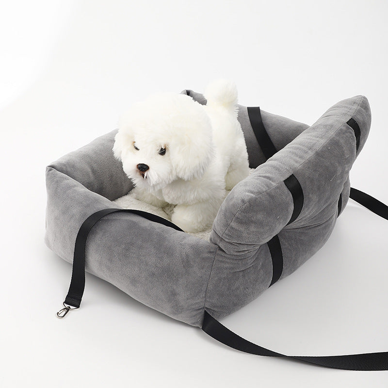 "Soft cushioned dog car seat with safety straps for secure travel, fitting most vehicles, ideal for comfortable pet journeys.