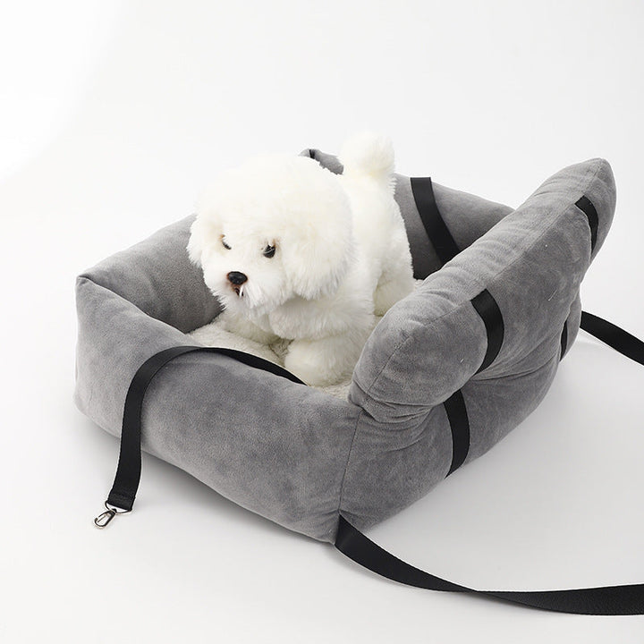 "Soft cushioned dog car seat with safety straps for secure travel, fitting most vehicles, ideal for comfortable pet journeys.