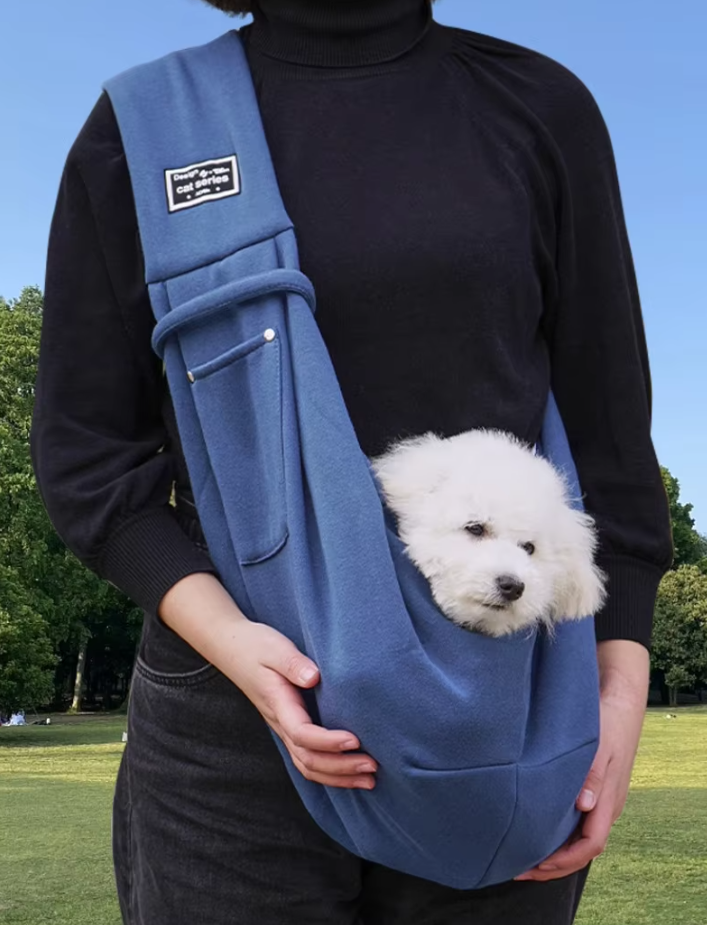 "Stylish pet carrier bag with padded strap for small dogs and cats, featuring breathable, lightweight design for travel comfo