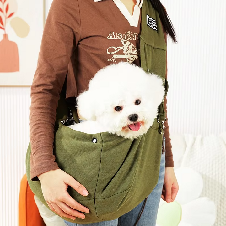 "Stylish pet carrier bag with padded strap for small dogs and cats, featuring breathable, lightweight design for travel comfo