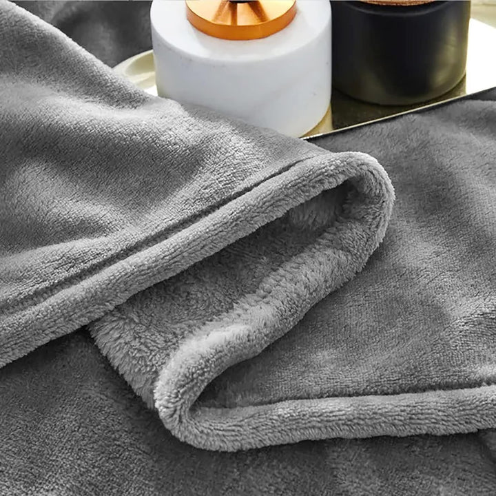 "Ultra-soft faux fur large sofa throw blanket in light grey, adding warmth and style to any living space, perfect for cozy de