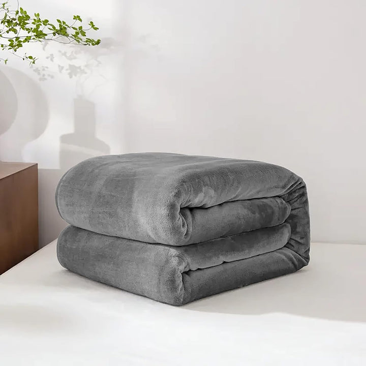 "Ultra-soft faux fur large sofa throw blanket in light grey, adding warmth and style to any living space, perfect for cozy de