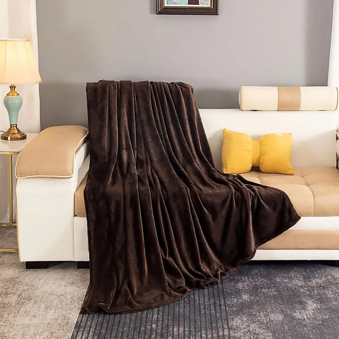 "Ultra-soft faux fur large sofa throw blanket in light grey, adding warmth and style to any living space, perfect for cozy de