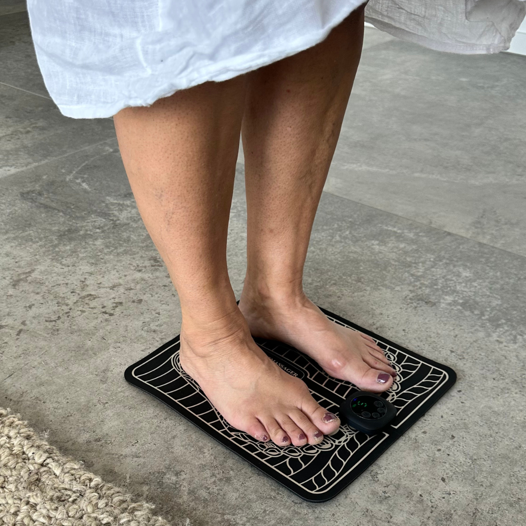 "Unisex EMS foot massager with a sleek design, showcasing six massage modes and portability for pain relief and relaxation."