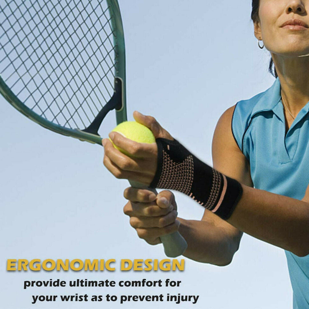 Unisex copper wrist and hand compression brace in sleek black, offering ergonomic support and pain relief for enhanced mobili