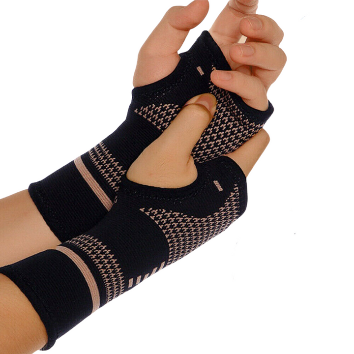 Unisex copper wrist and hand compression brace in sleek black, offering ergonomic support and pain relief for enhanced mobili