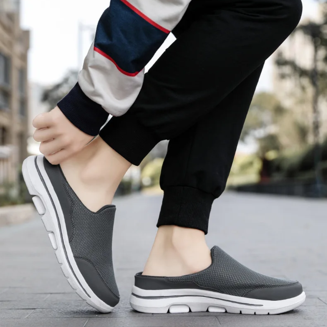 Unisex slip-on sports shoes with breathable mesh, cushioned insole, and sleek design in grey, black, blue, and brown.