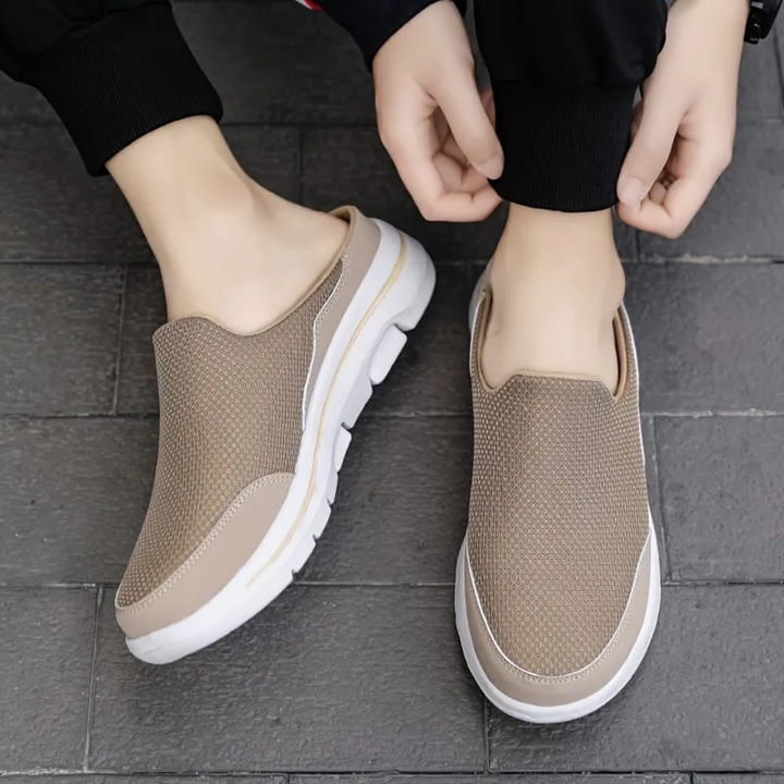 Unisex slip-on sports shoes with breathable mesh, cushioned insole, and sleek design in grey, black, blue, and brown.