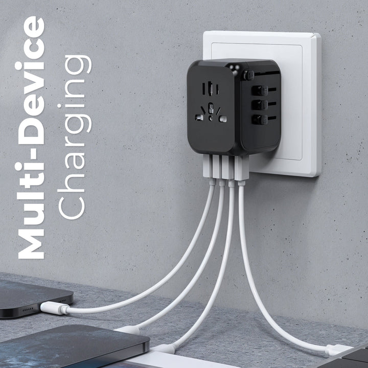 "Universal travel adapter, compact black design, with USB ports and global plug compatibility for 150+ countries."