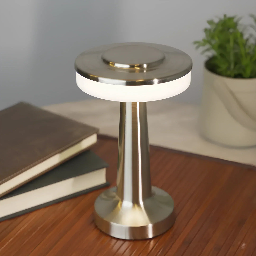 "Wireless retro table lamp with luxurious metallic finish, dimmable LED light, versatile cordless design for any setting."