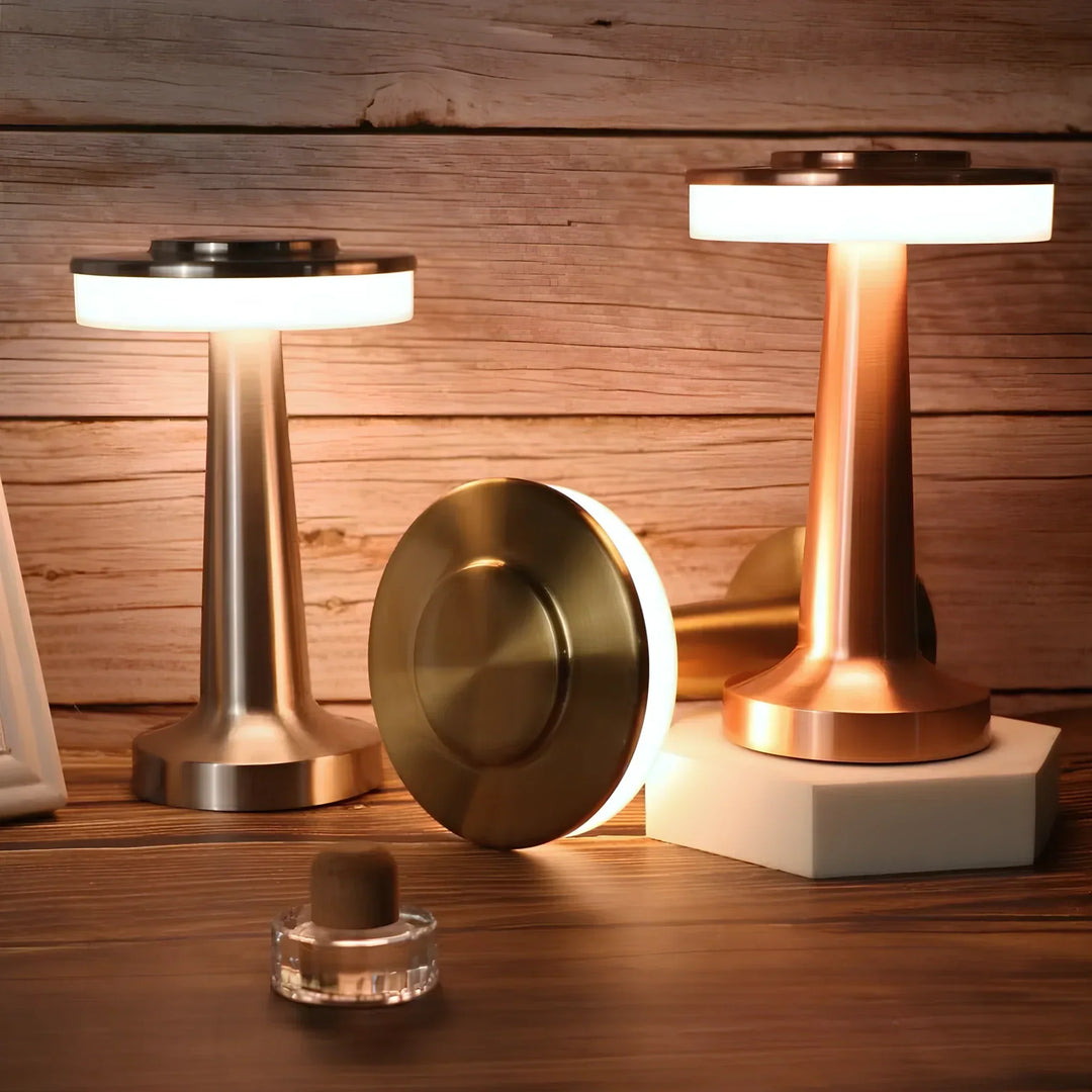 "Wireless retro table lamp with luxurious metallic finish, dimmable LED light, versatile cordless design for any setting."