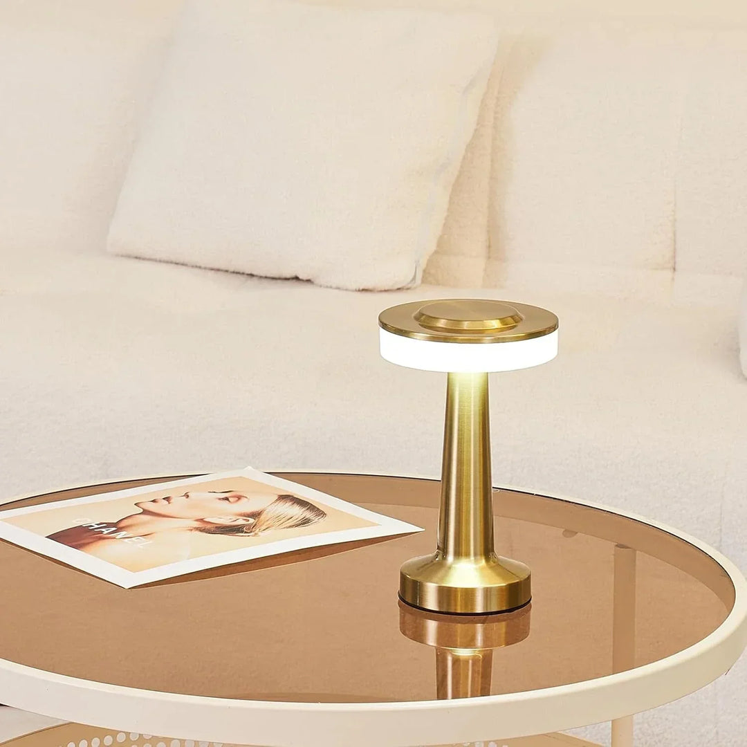 "Wireless retro table lamp with luxurious metallic finish, dimmable LED light, versatile cordless design for any setting."
