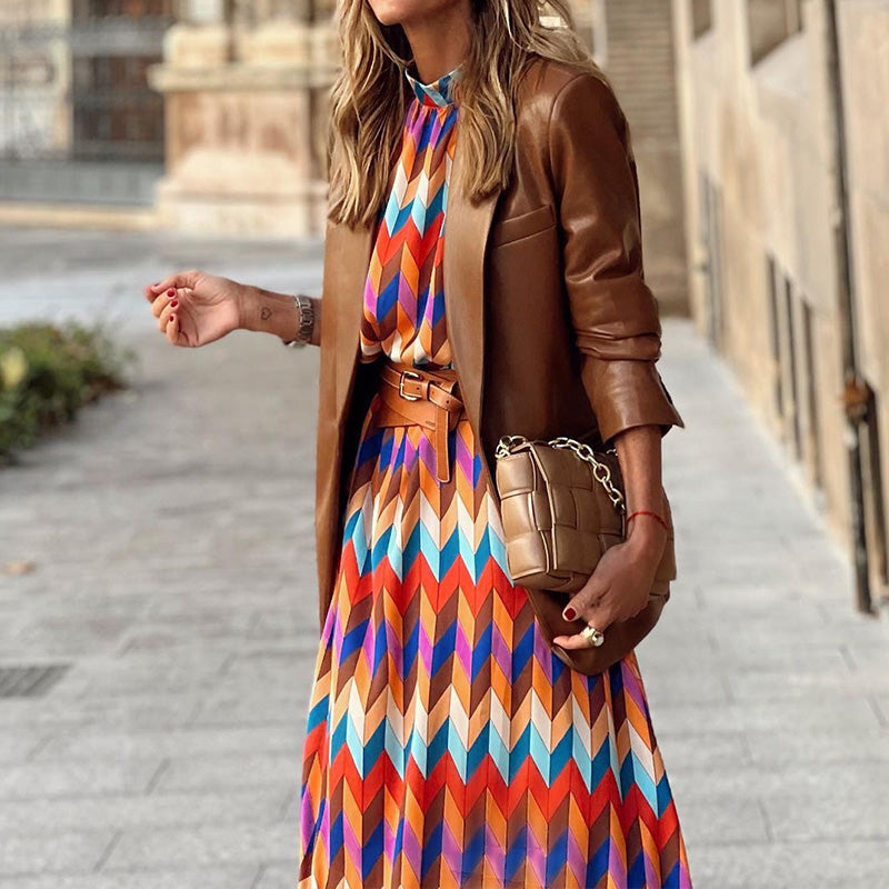 Woman wearing a vibrant, artistic print midi dress, flattering fit, breathable, perfect for sunny days and casual outings.