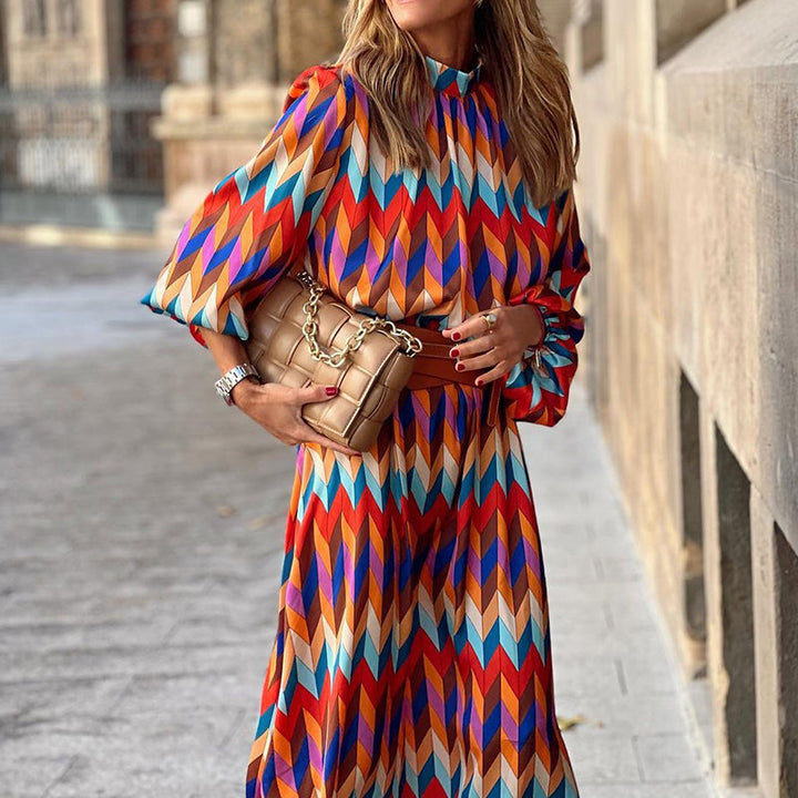 Woman wearing a vibrant, artistic print midi dress, flattering fit, breathable, perfect for sunny days and casual outings.