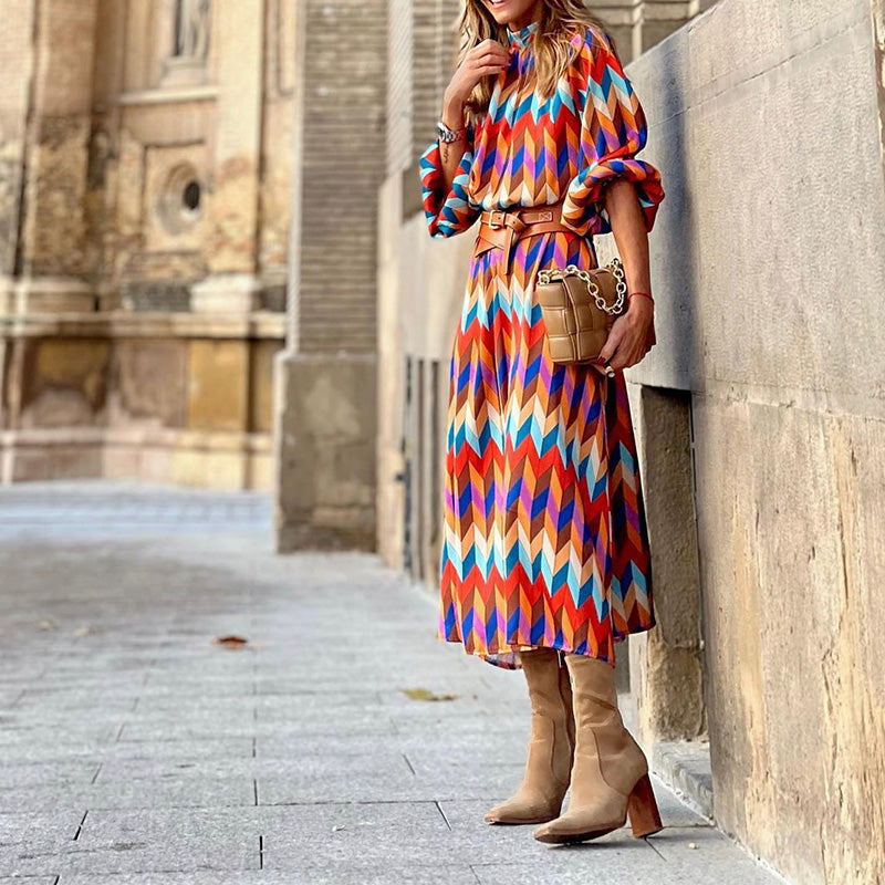 Woman wearing a vibrant, artistic print midi dress, flattering fit, breathable, perfect for sunny days and casual outings.