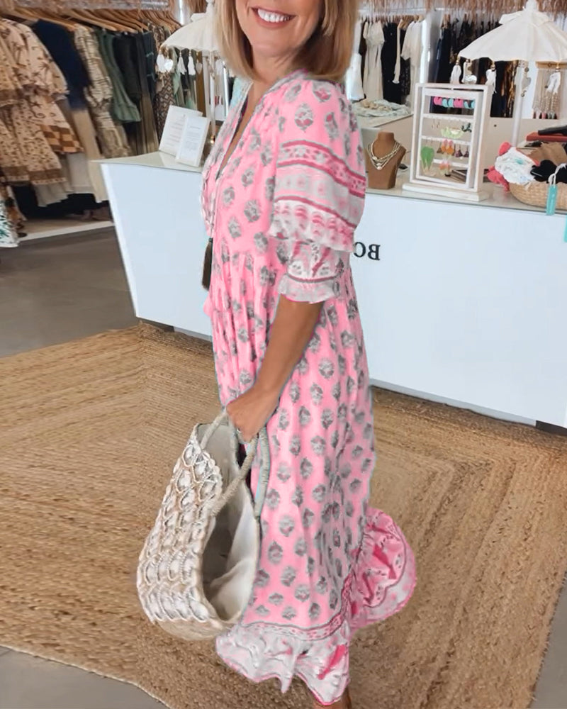 Women's V-Neck Half-Sleeve Dress with bold print, vibrant colors; casual or evening wear, enhances elegance and comfort.