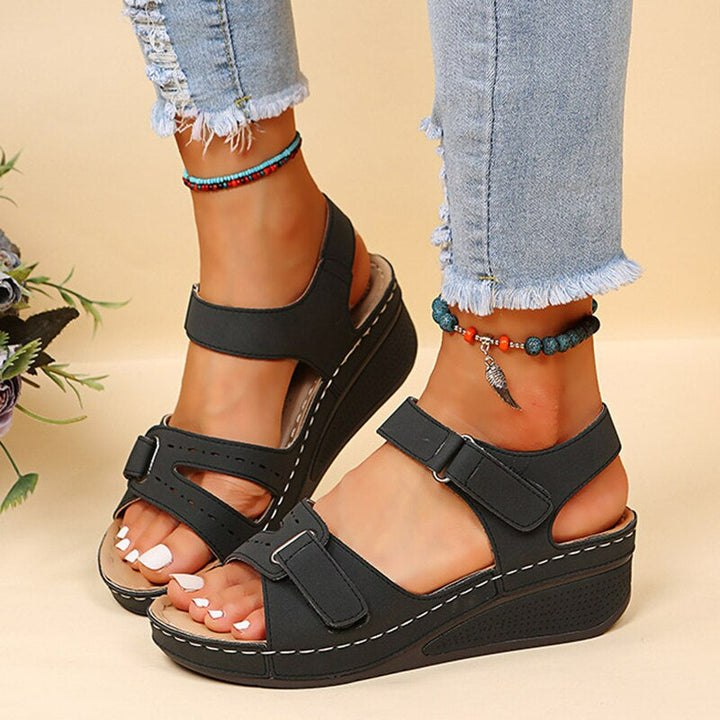 Women's cushioned supportive sandals with comfort soles, elegant design, enhanced arch support, available in several colors.
