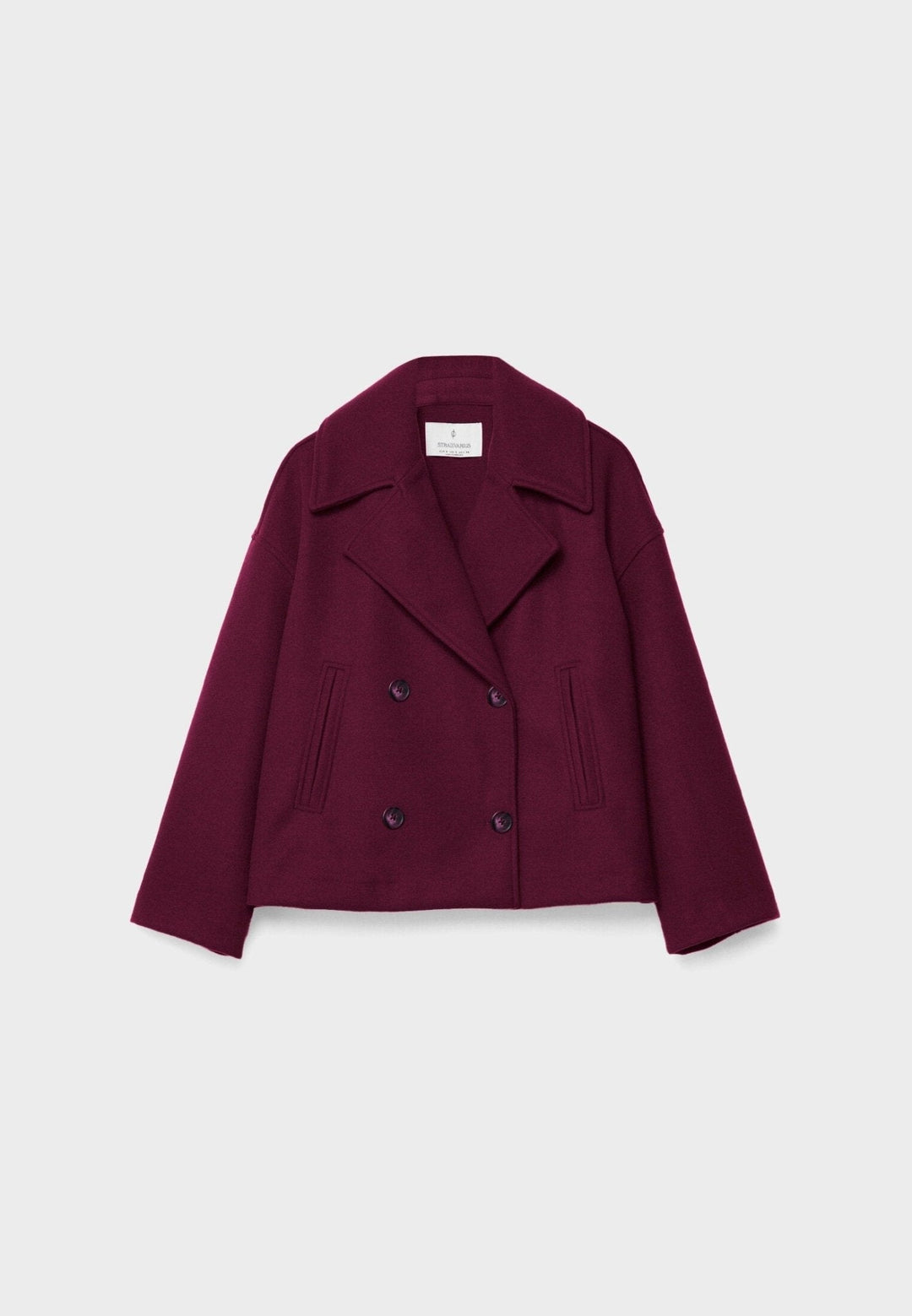 Women's double-breasted cropped jacket, front view featuring sharp lapels, structured design, and chic oversized buttons.