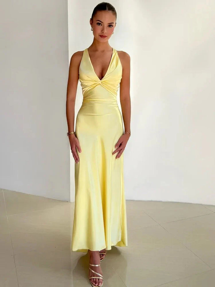 "Women's elegant sleeveless party dress, mid to mini length, flattering fit, perfect for special occasions and evening events