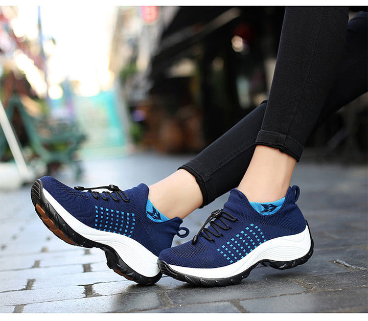 "Women's orthopaedic comfort shoes with contoured footbed, mesh upper in black and purple, providing advanced support."