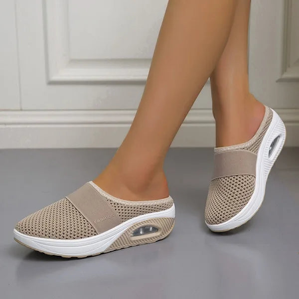Lifestyle image of women wearing stylish and versatile orthopedic breathable slippers at home.