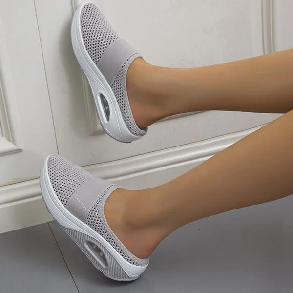 Women's orthopedic breathable slippers in beige, highlighting comfort and support.